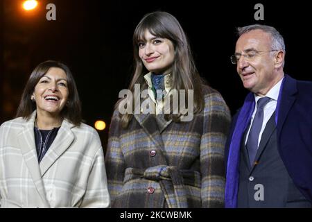 Mayor of Paris and French Socialist Party (PS) candidate for the April 2022 presidential election Anne Hidalgo (L), President of the Champs-Elysees Committee Marc-Antoine Jamet (R), and French singer Clara Luciani (C) take part in the inauguration of the Champs-Elysees Avenue Christmas season lights in Paris on November 21, 2021. (Photo by Michel Stoupak/NurPhoto) Stock Photo