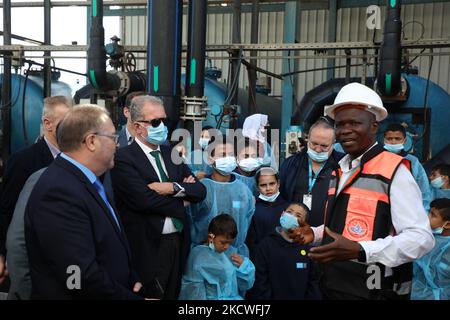 Members of a EU delegation listen to a employee during a visit to a desalination plant in Deir al-Balah in the central Gaza Strip, on November 24, 2021. (Photo by Majdi Fathi/NurPhoto) Stock Photo