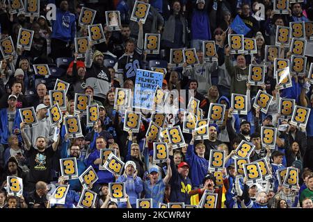 Detroit Lions fans hold signs during an NFL football game against