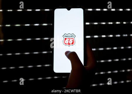 In this photo illustration a Phillips 66 oil company is displayed on a smartphone screen in Athens, Greece on November 28, 2021. (Photo by Nikolas Kokovlis/NurPhoto) Stock Photo