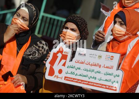 Palestinians participate in the launch event of the16 Days of Activism against Gender-based Violence in Gaza City, on November 28, 2021. The United Nations is marking the 16 Days of Activism against Gender-based Violence from 25 November to 10 December 2021, under the global theme set by the UN Secretary-Generalâ€™s UNiTE campaign: â€œOrange the World: End Violence against Women Now!â€. (Photo by Majdi Fathi/NurPhoto) Stock Photo