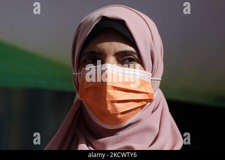 Palestinians participate in the launch event of the16 Days of Activism against Gender-based Violence in Gaza City, on November 28, 2021. The United Nations is marking the 16 Days of Activism against Gender-based Violence from 25 November to 10 December 2021, under the global theme set by the UN Secretary-Generalâ€™s UNiTE campaign: â€œOrange the World: End Violence against Women Now!â€. (Photo by Majdi Fathi/NurPhoto) Stock Photo