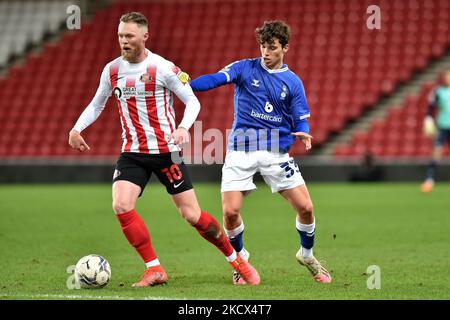 Oldham Athletic's Benny Couto tussles with Aiden O'Brien of Sunderland during the EFL Trophy match between Sunderland and Oldham Athletic at the Stadium Of Light, Sunderland on Wednesday 1st December 2021. (Photo by Eddie Garvey/MI News/NurPhoto) Stock Photo