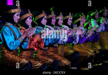 Acehnese dancers perform Saman dance, a traditional Indonesian dance, during a culture carnival in Bogor, West Java, Indonesia, on December 3, 2021. (Photo by Adriana Adie/NurPhoto) Stock Photo