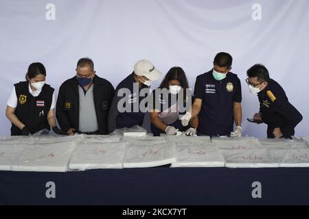 Thai Customs Department unpack evidence as they seized 897 kilograms of crystal methamphetamine worth 2.7 billion baht ($79,733,079) after Thai customs intercepted packages headed for Taiwan, in Bangkok, Thailand, 04 December 2021. (Photo by Anusak Laowilas/NurPhoto) Stock Photo