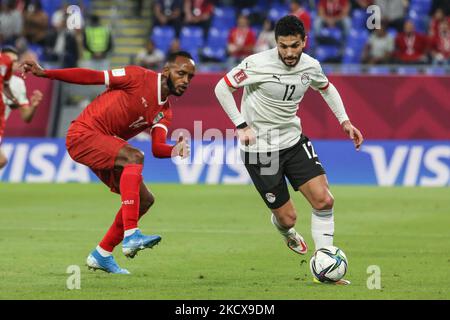 (12) AYMAN ASHRAF of Egypt team battles for possession (14) SALAHELDIN ADIL of Sudan team during The FIFA Arab Cup Qatar 2021 Group D match between Sudan and Egypt at Stadium 974 on December 4, 2021 in Doha, Qatar. (Photo by Ayman Aref/NurPhoto) Stock Photo