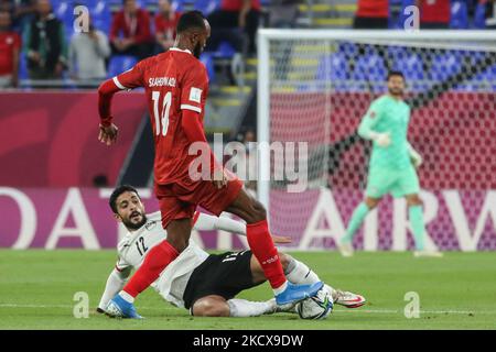 (12) AYMAN ASHRAF of Egypt team battles for possession (14) SALAHELDIN ADIL of Sudan team during The FIFA Arab Cup Qatar 2021 Group D match between Sudan and Egypt at Stadium 974 on December 4, 2021 in Doha, Qatar. (Photo by Ayman Aref/NurPhoto) Stock Photo