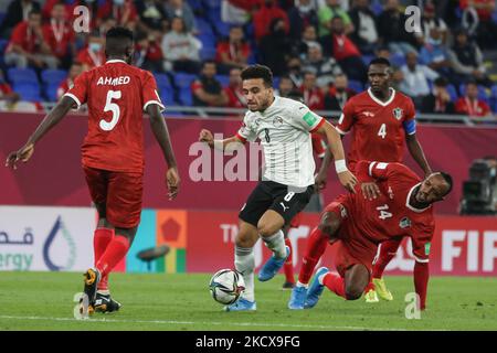 (8) MARWAN DAOUD of Egypt team battles for possession (14) SALAHELDIN ADIL ,(5) AHMED IBRAHIM of Sudan team during The FIFA Arab Cup Qatar 2021 Group D match between Sudan and Egypt at Stadium 974 on December 4, 2021 in Doha, Qatar. (Photo by Ayman Aref/NurPhoto) Stock Photo