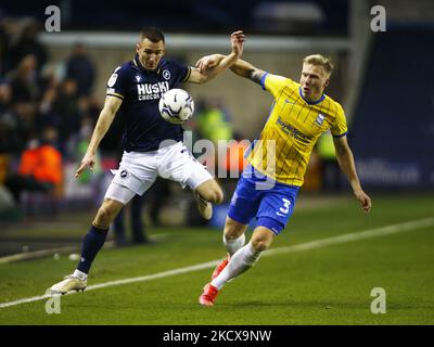 LONDON, United Kingdom, DECEMBER 04:L-R Jed Wallace of Millwall and Birmingham City's Kristian Pedersen during The Sky Bet Championship between Millwall and Birmingham City at The Den Stadium, London on 04th December 2021 (Photo by Action Foto Sport/NurPhoto) Stock Photo