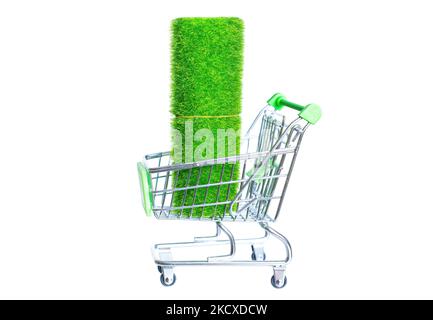 Fake grass and turf direct supplies: small green fibers carpet rolled in a miniature push cart isolated on white background. Stock Photo