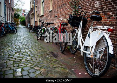 A view of one of the famous narrow passages full of bikes during a rainy day in the Dutch city of Leiden, on December 9th, 2021. (Photo by Romy Arroyo Fernandez/NurPhoto) Stock Photo