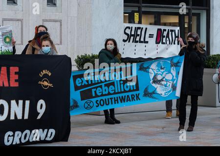 LONDON, UNITED KINGDOM - DECEMBER 10, 2021: Activists from Extinction Rebellion and Fossil Free London stage a protest outside Shell's corporate offices against the company's plan to move its headquarters to the United Kingdom on December 10, 2021 in London, England. Today, the shareholders of Royal Dutch Shell are expected to vote on the restructuring proposals which would see the company drop its complex dual share structure and move its tax residency and headquarters from the Netherlands to Britain. (Photo by WIktor Szymanowicz/NurPhoto) Stock Photo