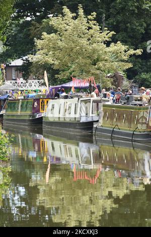 Moored boats at a canal festival in Ellesmere Shropshire during a summer event held every year. Stock Photo