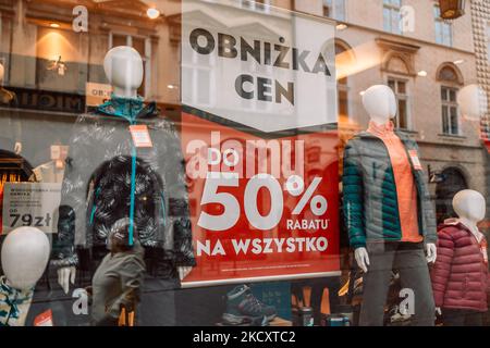 Gdansk, Poland, Europe - October 21 2022: Stack clothes In Store Of Shopping Center. shelf display in shop mall store. Store Of Shopping Center Stock Photo