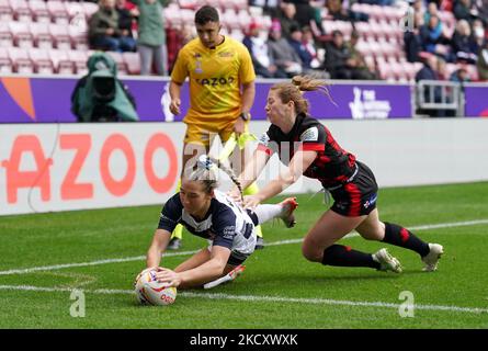 Canada's Lauren Mueller (right) fails to stop England's Georgia Wilson scores their side's third try during the Women's Rugby League World Cup Group A match at the DW Stadium, Wigan. Picture date: Saturday November 5, 2022. Stock Photo