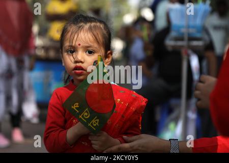 A Bangladeshi child holds a national flag during the celebrations of the 50th anniversary of Victory Day in Dhaka, Bangladesh on December 16, 2021. (Photo by Syed Mahamudur Rahman/NurPhoto) Stock Photo