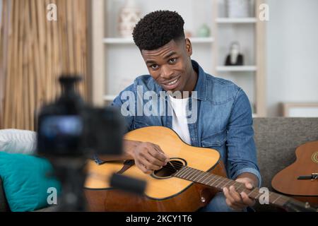 handsome man recording song vlogging concept Stock Photo