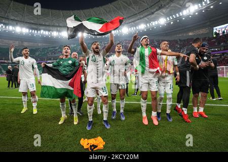 (10) BELAILI Mohammed , (17) DRAOUI Zakaria ,(9) BOUNEDJAH Baghdad ,(14)BENDEBKA Sofiane and (19) BEDRANE Abdelkader of Algeria team celebrate with teammate after match at the FIFA Arab Cup Qatar 2021 Semi-Final match between Qatar and Algeria at Al Thumana Stadium on December 15, 2021 in Doha, Qatar. (Photo by Ayman Aref/NurPhoto) Stock Photo