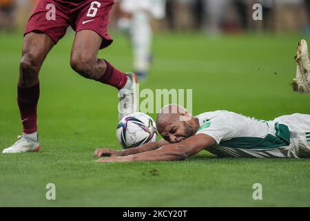 (6) AKRAM AFIF of Qatar obstruction (11) BENLAMRI Djamel of Algeria team which led to the penalty kickin the final seconds of the match at the FIFA Arab Cup Qatar 2021 Semi-Final match between Qatar and Algeria at Al Thumana Stadium on December 15, 2021 in Doha, Qatar. (Photo by Ayman Aref/NurPhoto) Stock Photo