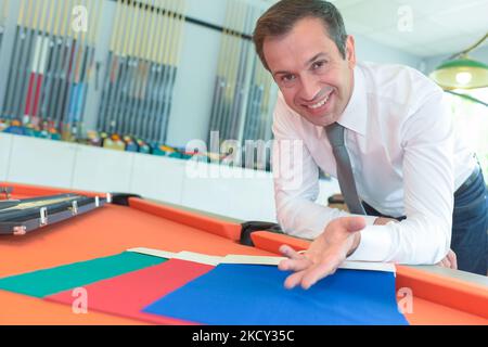 fashion designers discussing new fabric samples Stock Photo