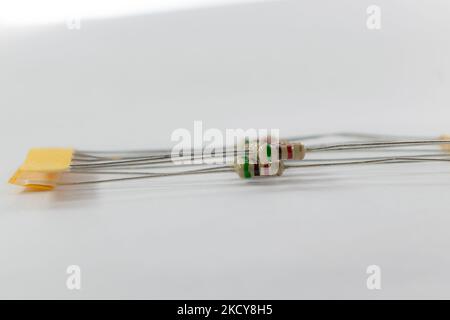 close up shot of resistors isolated on a white background.10kilo ohm carbon resistors isolated. Stock Photo