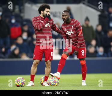 L-R Liverpool's Mohamed Salah and Liverpool's Naby Keita during the pre-match warm-up during Premier League between Tottenham Hotspur and Liverpool at Tottenham Hotspur stadium , London, England on 19th December 2021 (Photo by Action Foto Sport/NurPhoto) Stock Photo