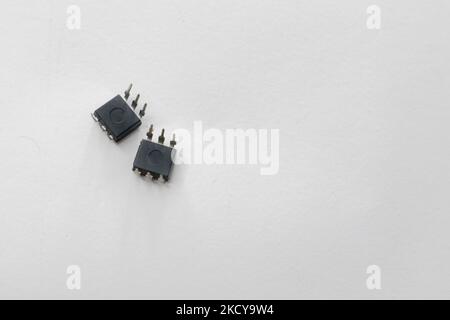 Optocoupler is a six pin  IC and it comes with dual inline package. IC isolated. Stock Photo