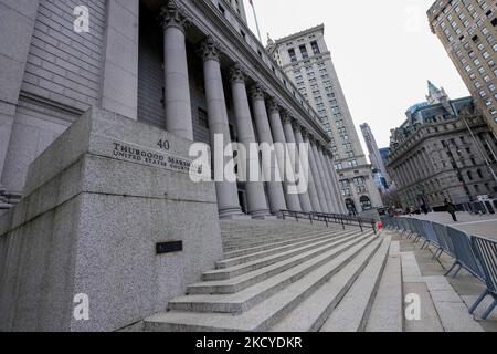 Four-year-old Ghislaine Maxwell, who is sat on the knees of George