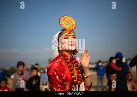 A girl from the Kirat community wearing traditional attire dances during the Sakela festival in Kathmandu, Nepal on Saturday, January 1, 2022. (Photo by Rojan Shrestha/NurPhoto) Stock Photo