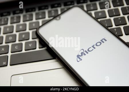 In this photo illustration a Micron logo seen displayed on a smartphone screen with a computer keyword in the background in Athens, Greece on January 2, 2022. (Photo by Nikolas Kokovlis/NurPhoto) Stock Photo