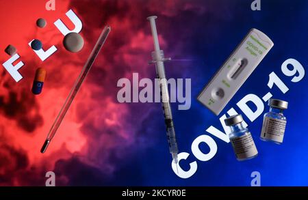 An illustrative image of a medical thermometer, flu medication, medical syringe, Covid-19 Antigen Rapid test and Covid-19 vaccine vials. On Tuesday, January 4, 2021, in Edmonton, Alberta, Canada. (Photo by Artur Widak/NurPhoto) Stock Photo