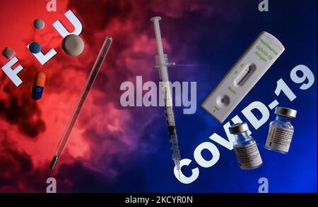 An illustrative image of a medical thermometer, flu medication, medical syringe, Covid-19 Antigen Rapid test and Covid-19 vaccine vials. On Tuesday, January 4, 2021, in Edmonton, Alberta, Canada. (Photo by Artur Widak/NurPhoto) Stock Photo