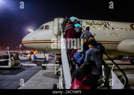 Passengers board an Etihad Airways airplane at Abu Dhabi International Airport in Abu Dhabi, United Arab Emirates, on February 02, 2020. (Photo by Creative Touch Imaging Ltd./NurPhoto) Stock Photo