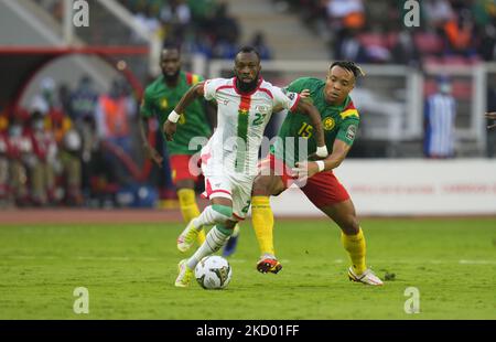 Blati Touré of Burkina Faso and Pierre Kunde of Cameroon during Cameroon against Burkina Faso, African Cup of Nations, at Paul Biya Stadium on January 9, 2022. (Photo by Ulrik Pedersen/NurPhoto) Stock Photo