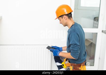 Heater Installation And Repair In House. Heat Pump Services Stock Photo