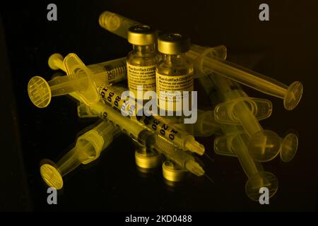 An illustrative image of medical syringes and two Pfizer-BioNTech Covid-19 vaccine vials. On Monday, January 10, 2021, in Edmonton, Alberta, Canada. (Photo by Artur Widak/NurPhoto) Stock Photo