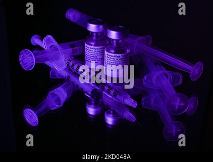 An illustrative image of medical syringes and two Pfizer-BioNTech Covid-19 vaccine vials. On Monday, January 10, 2021, in Edmonton, Alberta, Canada. (Photo by Artur Widak/NurPhoto) Stock Photo