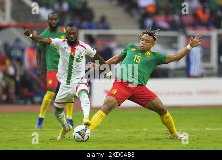 Blati Touré of Burkina Faso and Pierre Kunde of Cameroon during Cameroon against Burkina Faso, African Cup of Nations, at Paul Biya Stadium on January 9, 2022. (Photo by Ulrik Pedersen/NurPhoto) Stock Photo