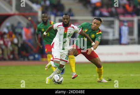 Blati Touré of Burkina Faso and Pierre Kunde of Cameroon during Cameroon against Burkina Faso, African Cup of Nations, at Paul Biya Stadium on January 9, 2022. (Photo by Ulrik Pedersen/NurPhoto) Stock Photo