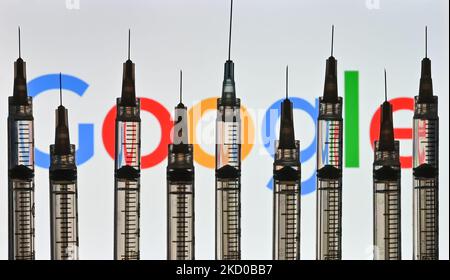 Illustrative photo of medical syringes seen in front of a Google logo displayed on a computer screen. On Thursday, January 14, 2021, in Edmonton, Alberta, Canada. (Photo by Artur Widak/NurPhoto) Stock Photo