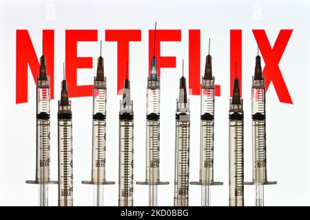 Illustrative photo of medical syringes seen in front of a Facebook logo displayed on a computer screen. On Thursday, January 14, 2021, in Edmonton, Alberta, Canada. (Photo by Artur Widak/NurPhoto) Stock Photo