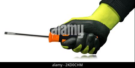 Manual worker with black and green protective work gloves holding a flat head screwdriver with black and orange plastic handle. Isolated on white. Stock Photo