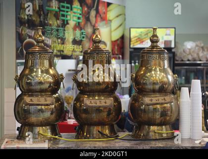 Large brass containers filled with medicinal Chinese herbal tea at a Chinese tea shop in Markham, Ontario, Canada. (Photo by Creative Touch Imaging Ltd./NurPhoto) Stock Photo