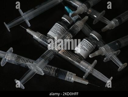 An illustrative image of medical syringes and Pfizer-BioNTech Covid-19 vaccine vials. On Sunday, January 16, 2021, in Edmonton, Alberta, Canada. (Photo by Artur Widak/NurPhoto) Stock Photo