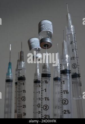 An illustrative image of medical syringes and Pfizer-BioNTech Covid-19 vaccine vials. On Sunday, January 16, 2021, in Edmonton, Alberta, Canada. (Photo by Artur Widak/NurPhoto) Stock Photo