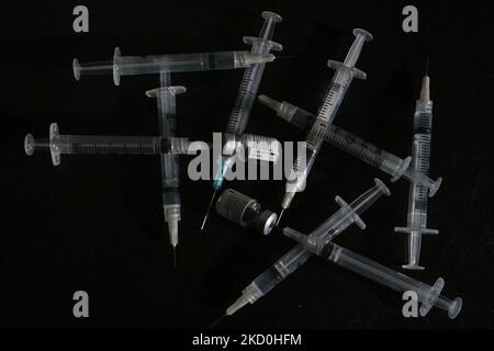 An illustrative image of medical syringes and Pfizer-BioNTech Covid-19 vaccine vials. On Sunday, January 16, 2021, in Edmonton, Alberta, Canada. (Photo by Artur Widak/NurPhoto) Stock Photo