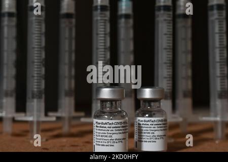 An illustrative image of medical syringes and Pfizer-BioNTech Covid-19 vaccine vials. On Sunday, January 16, 2021, in Edmonton, Alberta, Canada. (Photo by Artur Widak/NurPhoto) Stock Photo