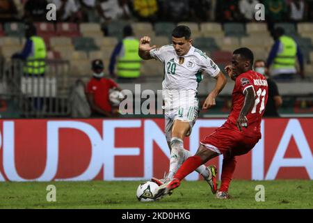 20) Youcef Atal of Algeria team fight for the ball with (11