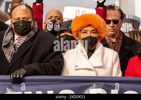 Martin Luther King III and Congresswoman Joyce Beatty (D-OH) march at the front of the DC Peace Walk. MLK III, Arndrea Waters King, and Yolanda Renee King and other civil rights leaders joined the Peace Walk this year to march for voting rights. The King family asked Americans not to celebrate the birthday of MLK Jr. if the Senate had not yet passed legislation to protect voting rights, but to take action to stop voter suppression. The Frederick Douglass Memorial Bridge was chosen to emphasize the message that if Congress can create an exception to the filibuster to pass the infrastructure bil Stock Photo