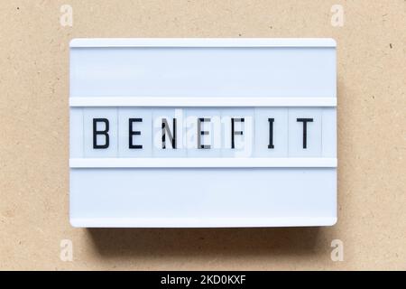 Lightbox with word benefit on wood background Stock Photo